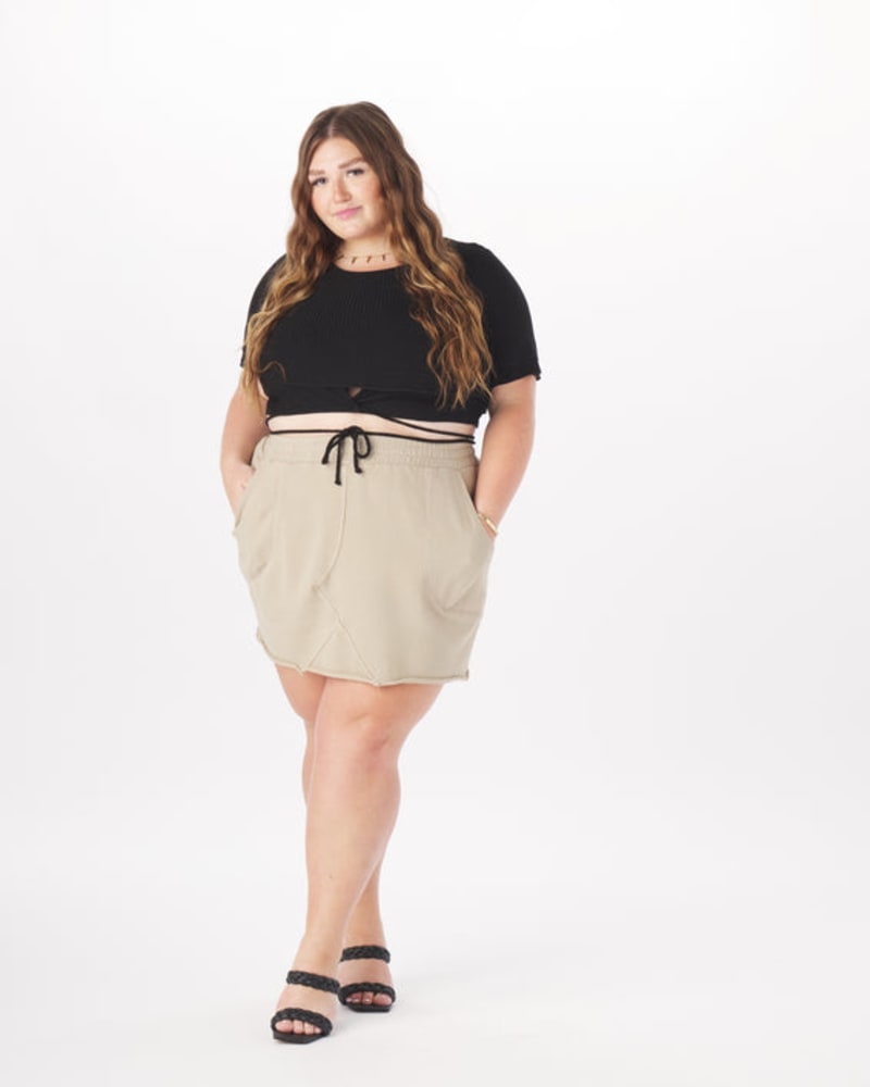 Front of a model wearing a size 4X Amanda Terry Sweat Skirt in Taupe in Taupe by What Lo Wants. | dia_product_style_image_id:237943